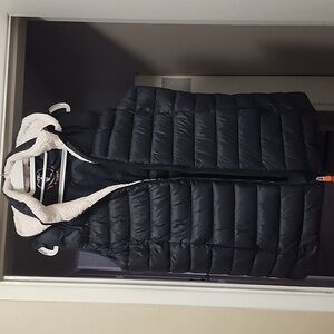 Save the Duck puffer vest with a detachable hood.